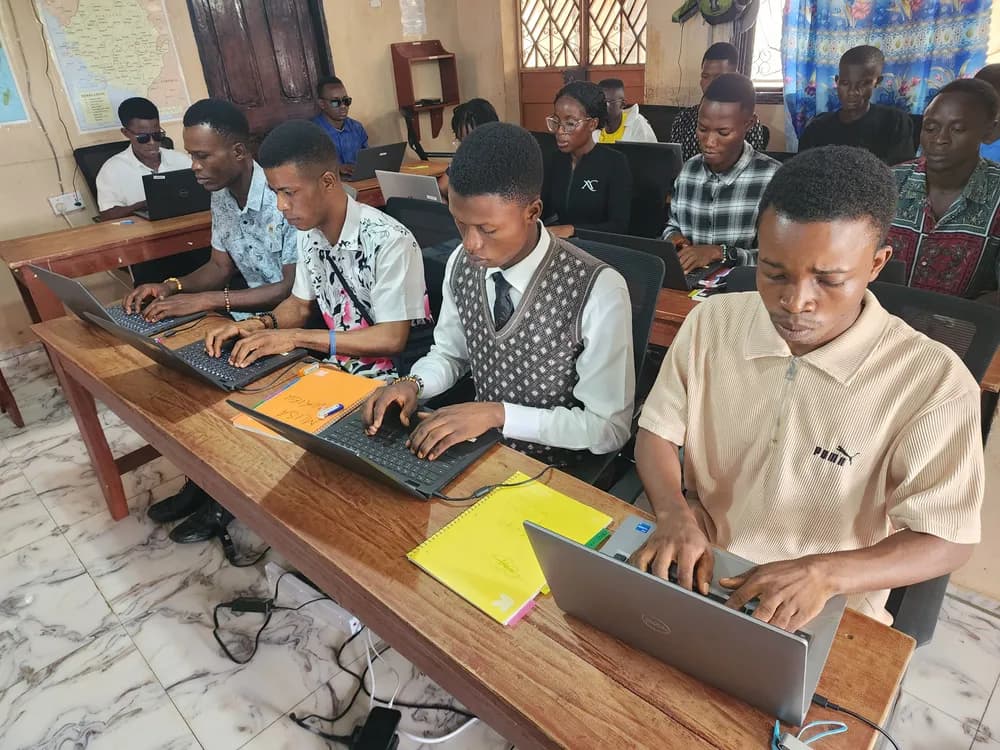 Students practising on laptops in the computer lab