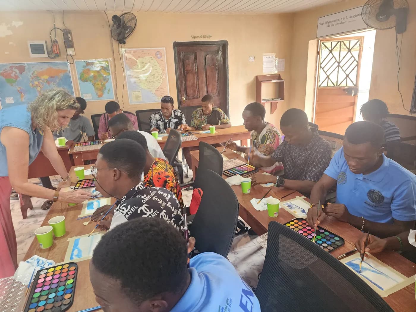 Students painting during an international workshop session